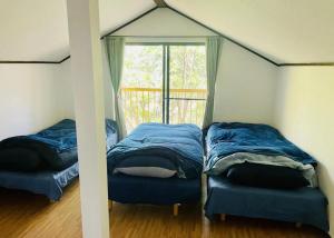 Postel nebo postele na pokoji v ubytování 秩父 思源屋