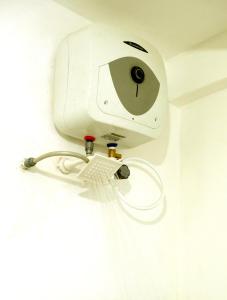a security camera on a wall in a room at Cottage 23 in Kurunegala