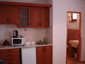 Kuchyňa alebo kuchynka v ubytovaní Mediterrán Apartman és Vendégház
