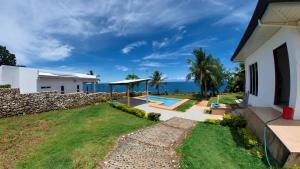 a house with a view of the ocean at The Gabayan Riviera in Siquijor