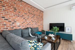 Televízia a/alebo spoločenská miestnosť v ubytovaní Avenue Apartment - LoftAffair