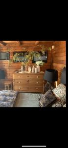 a bedroom with a bed and a table with a lamp at Residence Paradisu Ajaccio in Appietto