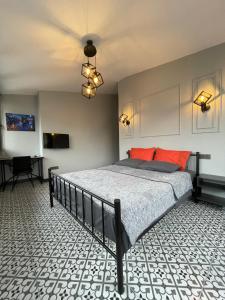 a bedroom with a large bed with a ceiling at Beyoğlu Huzur Apart in Istanbul