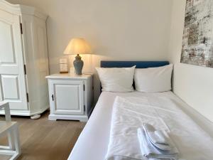 Postel nebo postele na pokoji v ubytování Appartement-Hotel Timmendorfer Strand