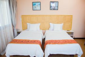 En eller flere senger på et rom på Hotel Cristal Madagascar