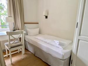 Postel nebo postele na pokoji v ubytování Appartement-Hotel Timmendorfer Strand