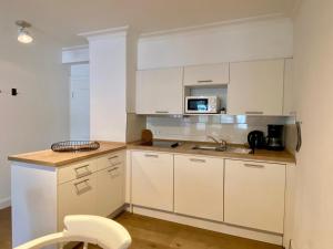 Kuchyň nebo kuchyňský kout v ubytování Appartement-Hotel Timmendorfer Strand