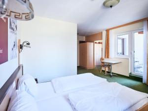 Postel nebo postele na pokoji v ubytování Hotel Kirchboden by Alpeffect Hotels