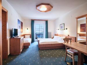 Postel nebo postele na pokoji v ubytování Hotel Kirchboden by Alpeffect Hotels