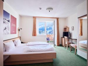 Voodi või voodid majutusasutuse Hotel Kirchboden by Alpeffect Hotels toas +37 fotot
