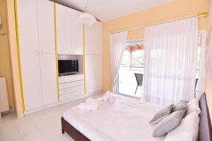 Postel nebo postele na pokoji v ubytování Fat Mermaid Seaside Villa