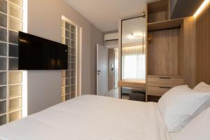 LUX&EASY Athens Downtown Residences客房内的一张或多张床位