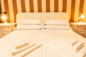 Postel nebo postele na pokoji v ubytování B&B L'EDEN