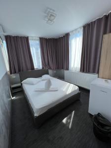 Кровать или кровати в номере Hotel Miniom