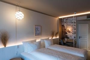 Ein Bett oder Betten in einem Zimmer der Unterkunft Hafenhotel zu Putbus