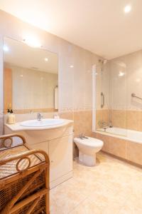 a bathroom with a sink and a toilet and a shower at Letmalaga Campos de Guadalmina in Marbella