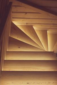 a shelf in a room with wooden shelves at SeaUSasino - Luksusowe Drewniane Domy z Kominkami in Sasino