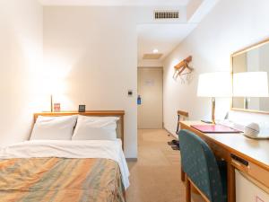 Postel nebo postele na pokoji v ubytování Tabist Hotel Mercury Asakusabashi