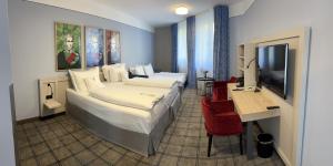 Postel nebo postele na pokoji v ubytování Hotel König Ludwig II