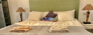 A bed or beds in a room at Casa VivaQi Tenerife