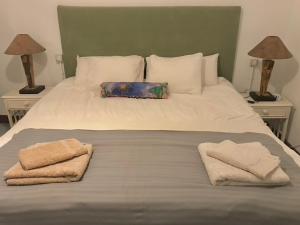 A bed or beds in a room at Casa VivaQi Tenerife