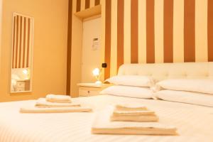 Postel nebo postele na pokoji v ubytování B&B L'EDEN