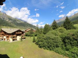 an aerial view of a house in the mountains at Appartement 4 pers. pied des pistes avec piscine et parking, Lanslebourg-Val Cenis - FR-1-508-251 in Lanslebourg-Mont-Cenis