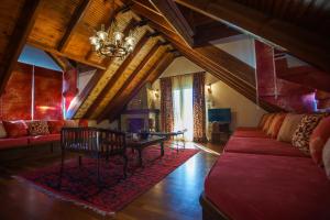 a living room with a couch and a table at Luxury Traditional Villa in Khiliódhendron