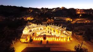 an aerial view of a large building at night at Nujel'm Cappadocia in Ürgüp