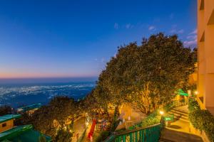 a view from a building at night at Sterling Mussoorie in Mussoorie