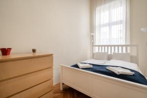 A bed or beds in a room at Lonyay Grand Central