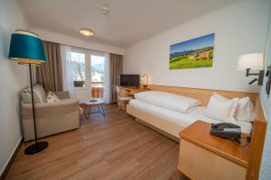 Postel nebo postele na pokoji v ubytování Hotel Filser