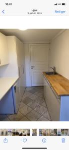 a kitchen with a sink and a counter top at Hellerup - suite 1 in Hellerup