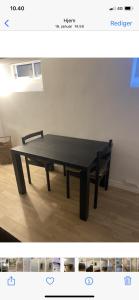 a black ping pong table in a room with a chair at Hellerup - suite 1 in Hellerup