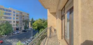 a balcony of a building with a view of a street at Hotel FN Shymkent in Shymkent