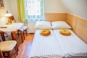 Posteľ alebo postele v izbe v ubytovaní Apartamenty Willa Alesandro