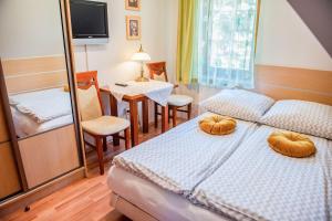 Posteľ alebo postele v izbe v ubytovaní Apartamenty Willa Alesandro
