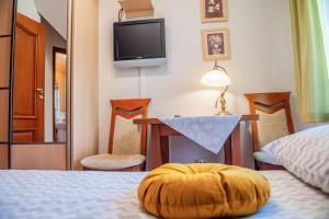 Posteľ alebo postele v izbe v ubytovaní Apartamenty Willa Alesandro