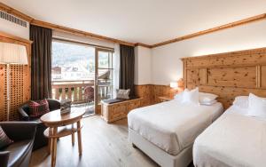 Postel nebo postele na pokoji v ubytování Hotel Angelo Engel + 37 fotografií