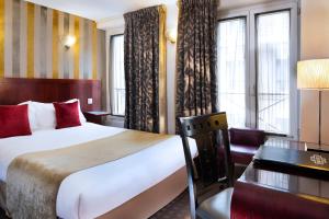 Postel nebo postele na pokoji v ubytování Hotel Opéra d'Antin