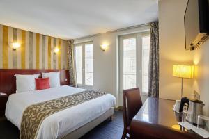 Postel nebo postele na pokoji v ubytování Hotel Opéra d'Antin