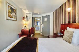 Postel nebo postele na pokoji v ubytování Hotel Opéra d'Antin
