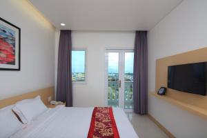 מיטה או מיטות בחדר ב-Hung Cuong Hotel