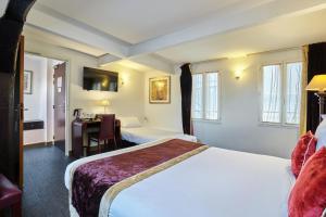 Postel nebo postele na pokoji v ubytování Hotel Opéra d'Antin