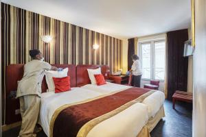 Postel nebo postele na pokoji v ubytování Hotel Opéra d'Antin
