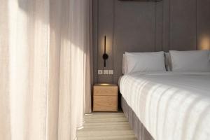 LUX&EASY Athens Downtown Residences客房内的一张或多张床位