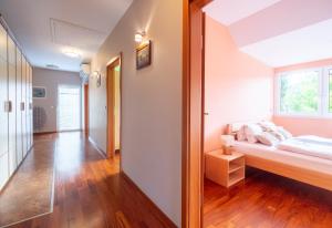 Ένα ή περισσότερα κρεβάτια σε δωμάτιο στο Apartments Apple Garden 4P