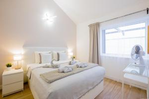 Łóżko lub łóżka w pokoju w obiekcie Bright & Stylish Apartment in Chipeque, Los Cristianos