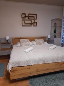 Posteľ alebo postele v izbe v ubytovaní Soda apartman