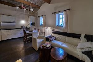 a living room with a couch and a table at Meschermolen 8 in Eijsden